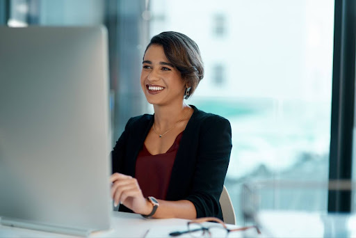 Woman typing at a desk